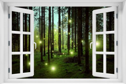 Fototapeta Naklejka Na Ścianę Okno 3D - Magic glowing firefly lights in dark evening mossy forest.