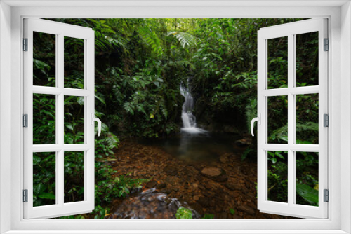 Fototapeta Naklejka Na Ścianę Okno 3D - Tropical rainforest with waterfall