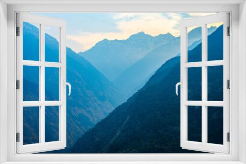 Fototapeta Naklejka Na Ścianę Okno 3D - Misty Mountain Layers at Dawn, Thulo Syabru to Sing Gompa Trek, Gosaikunda, Nepal