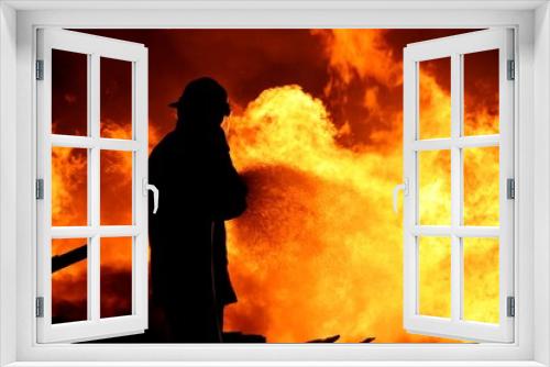 Fototapeta Naklejka Na Ścianę Okno 3D - Fireman fighting a fire