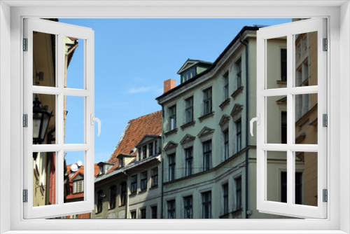 Fototapeta Naklejka Na Ścianę Okno 3D - Top floors of beautiful vintage colorful houses on Jauniela street in Riga old town in sunny cloudless day