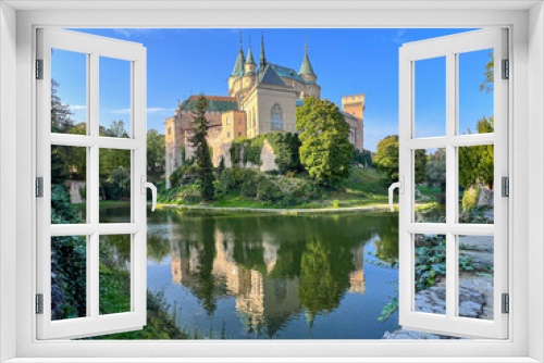 Fairy-tale Bojnice Castle in Slovakia, central Europe, owned by family of Palfi. Lake reflection. 