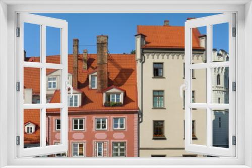 Fototapeta Naklejka Na Ścianę Okno 3D - Red roofs, dormers and chimneys (Riga, Latvia)