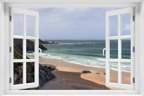 Fototapeta Naklejka Na Ścianę Okno 3D - A dramatic view of Durness Beach in Scotland, where rugged cliffs meet the pristine sands and the emerald waves of the Atlantic