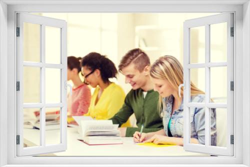 students with textbooks and books at school