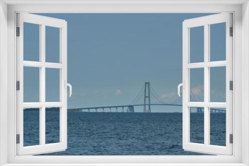 Fototapeta Naklejka Na Ścianę Okno 3D - great Storebelt suspension bridge connecting Denmarks islands across the baltic sea on a hazy sunny day.