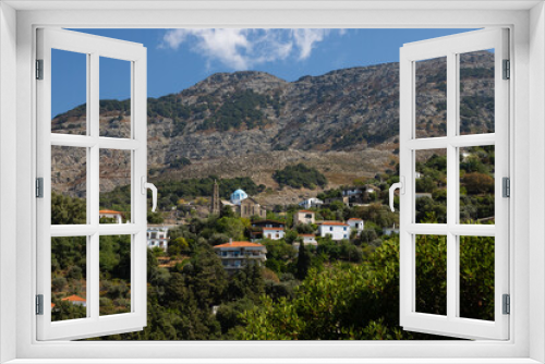 Fototapeta Naklejka Na Ścianę Okno 3D - Picturesque mountain village Arethousa with Saint Marina church, Ikaria island , Greece