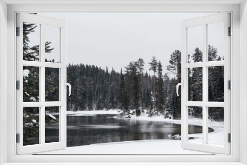 Fototapeta Naklejka Na Ścianę Okno 3D - winter landscape of ice-free lake and green trees