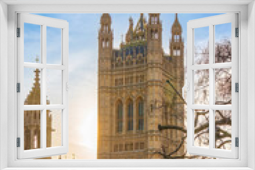 Fototapeta Naklejka Na Ścianę Okno 3D - View of the victoria Tower from the Parliament Square Garden in golden hour time. The united flag is in the top