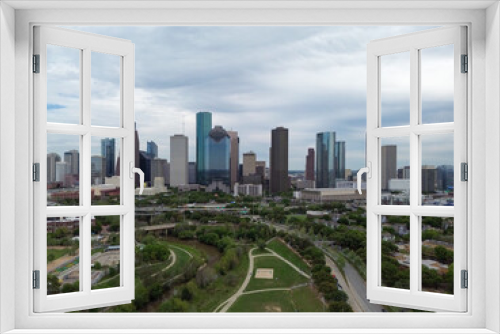 Downtown Houston, Texas skyline with traffic in the background on a busy freeway