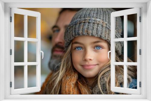 Portrait of a young girl with striking blue eyes and warm winter clothes, looking at camera