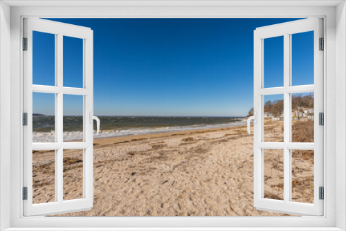 Fototapeta Naklejka Na Ścianę Okno 3D - Rocky and Sandy Beach Shoreline with Ocean View with Clear Blue Sky