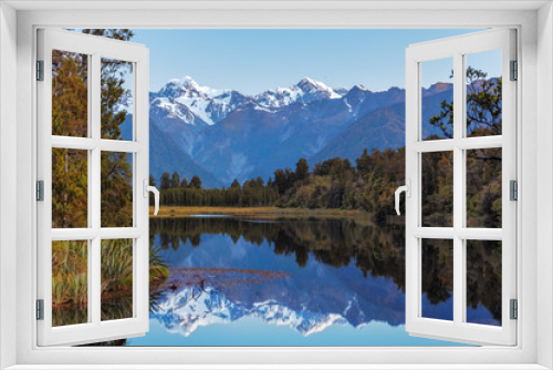 Fototapeta Naklejka Na Ścianę Okno 3D - Twin Peaks reflect in the beautiful Lake Matheson, New Zealand