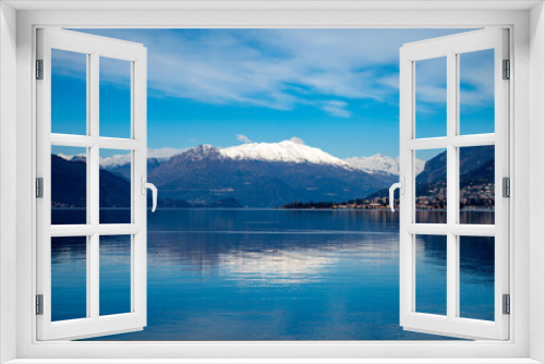 Fototapeta Naklejka Na Ścianę Okno 3D - Driving car along shores of Lake Como in Northern Italy, spring sunny days, views of alpine mountains, water and villages