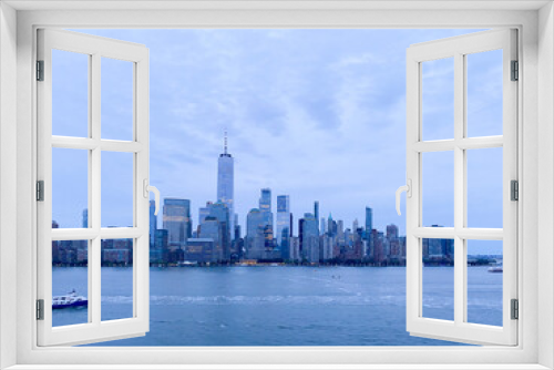 Fototapeta Naklejka Na Ścianę Okno 3D - New York City downtown skyline in blues and purples from Jersey City at dusk 