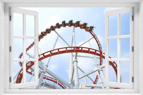 Fototapeta Naklejka Na Ścianę Okno 3D - Roller coaster with blue sky background in theme park