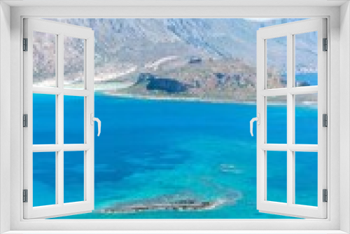 Fototapeta Naklejka Na Ścianę Okno 3D - Crystal-clear turquoise waters of Crete island in Greece with a rocky shoreline and hills