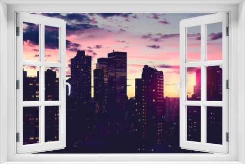 A city skyline with tall buildings silhouetted against a colorful sunset sky