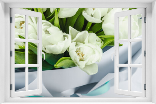 Fototapeta Naklejka Na Ścianę Okno 3D - A bouquet of white tulips on a pastel green background. Blooming flowers, festive concept