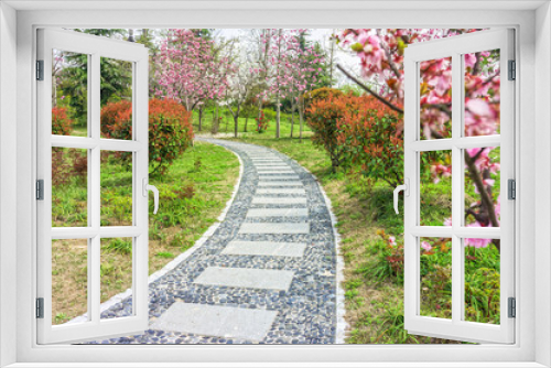 Fototapeta Naklejka Na Ścianę Okno 3D - The walkway in a garden