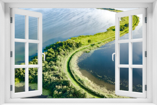 Fototapeta Naklejka Na Ścianę Okno 3D - Aerial drone view of path on dam in polder water from above, landscape and nature of North Holland, Netherlands
