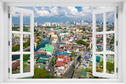 Fototapeta Naklejka Na Ścianę Okno 3D - Taguig, Metro Manila, Philippines - Aerial of the Taguig River and the cityscape, with the BGC skyline in the horizon.