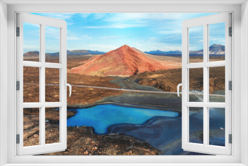 Fototapeta Naklejka Na Ścianę Okno 3D - Aerial landscape view of the cliffs, volcanic mountains and a blue lake on a natural park Los Hervideros, Lanzarote Island, Canaries - Spain