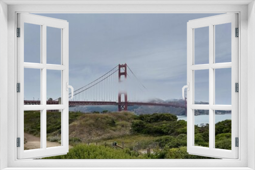 Fototapeta Naklejka Na Ścianę Okno 3D - Peaceful view of the Golden Gate Bridge in the clouds, San Francisco, California, USA