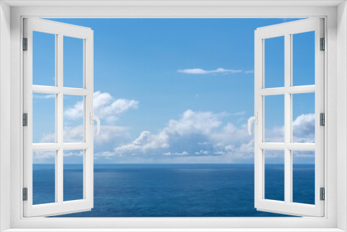 Fototapeta Naklejka Na Ścianę Okno 3D - View of blue sea and clouds in a blue sky