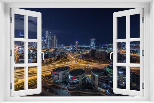Fototapeta Naklejka Na Ścianę Okno 3D - Dubai Media City with Modern buildings aerial night timelapse, United Arab Emirates
