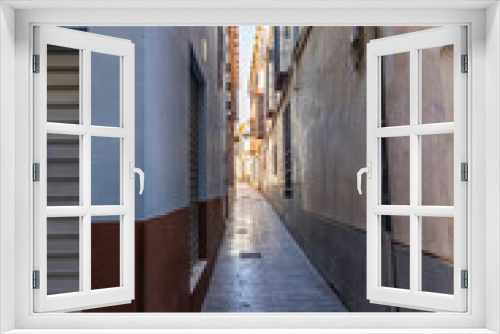 Fototapeta Naklejka Na Ścianę Okno 3D - A very narrow street of Malaga city