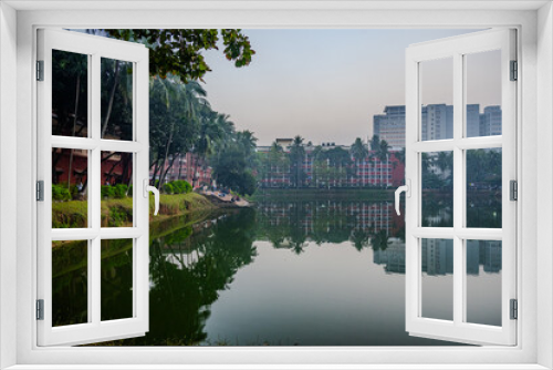 Fototapeta Naklejka Na Ścianę Okno 3D - Reflective Tranquility at Dhaka University's Lakeside
