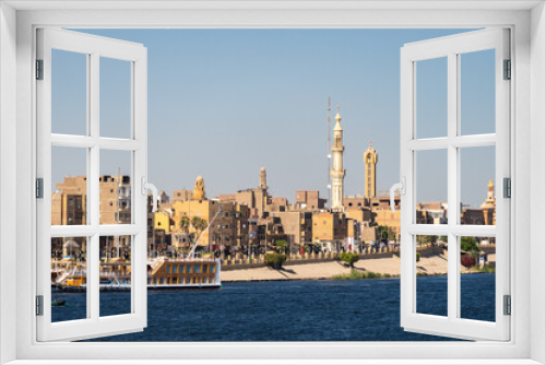 Fototapeta Naklejka Na Ścianę Okno 3D - The corniche of Esna town from the Nile river in Egypt