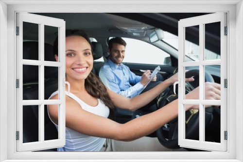 Young woman getting a driving lesson