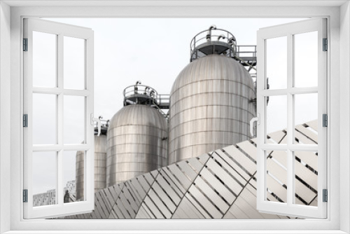 Fototapeta Naklejka Na Ścianę Okno 3D - Three silos in stainless steel