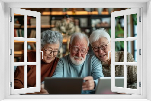 Senior sharing at their smartphones. Joyful senior friends sharing a fun moment while looking at their smartphones together.