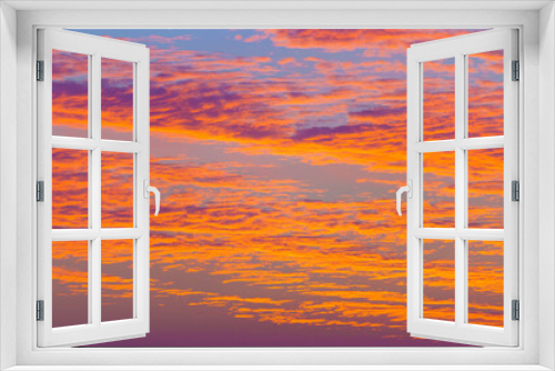 Fototapeta Naklejka Na Ścianę Okno 3D - A panoramic view of colourful beatiful evening sky with pink, purple, peach and orange clouds, Doha, Qatar