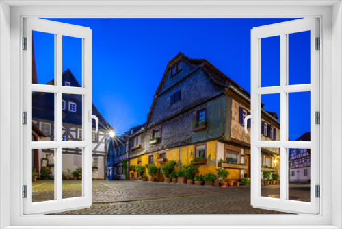 Fototapeta Naklejka Na Ścianę Okno 3D - View of an old town, half-timbered houses and streets in a city. Seligenstadt am Main, Hesse Germany