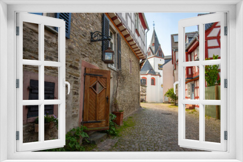 Fototapeta Naklejka Na Ścianę Okno 3D - View of an old town, half-timbered houses and streets in a city. Idstein im Taunus, Hesse Germany