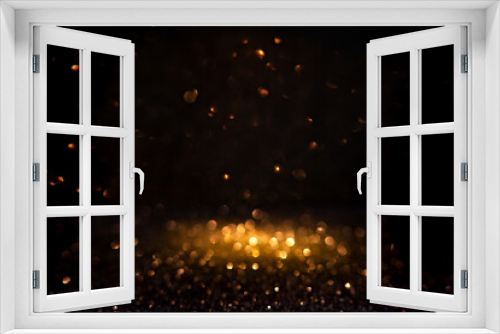 Fototapeta Naklejka Na Ścianę Okno 3D - Warm golden bokeh lights illuminate a dark backdrop, creating an abstract pattern of soft glowing orbs ideal for backgrounds. Blurred shine bokeh for overlay effect.