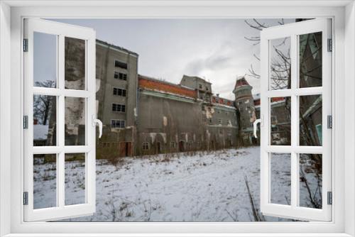 Fototapeta Naklejka Na Ścianę Okno 3D - Exploration of the historic old stone mill with a spiral staircase in Southern Poland, Europe, in Winter