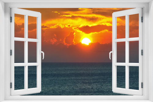 Fototapeta Naklejka Na Ścianę Okno 3D - Experience the mesmerizing sight of the infinite sea stretching to the horizon, bathed in the warm hues of a golden sunset, all from the unique viewpoint of a drone's aerial lens. Sea background.
