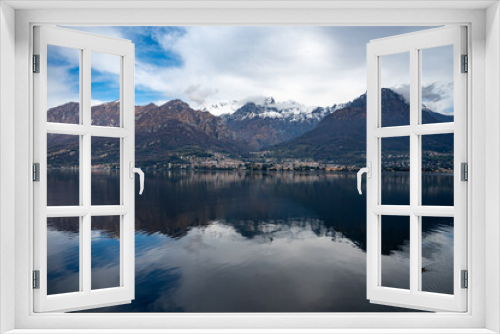 Fototapeta Naklejka Na Ścianę Okno 3D - Driving car along shores of Lake Como in Northern Italy, spring sunny days, views of alpine mountains, water and villages