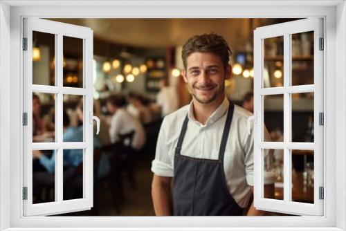 b'Portrait of a male chef smiling in a restaurant'