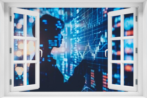 Businessman analyzing financial chart on virtual screen in modern office environment