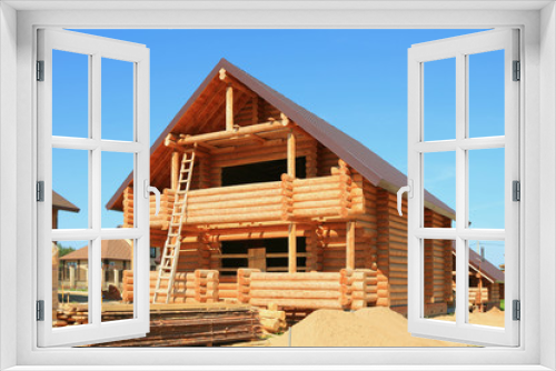 Fototapeta Naklejka Na Ścianę Okno 3D - Wooden housing construction. New wooden house