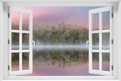 Fototapeta Naklejka Na Ścianę Okno 3D - Foggy spring landscape at dawn of Moccasin Lake with mirrored reflections in calm water, Hiawatha National Forest, Michigan's Upper Peninsula, USA