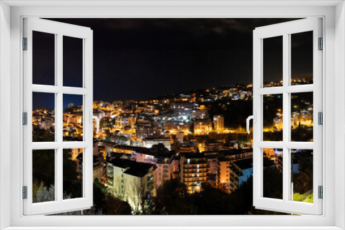 Fototapeta Naklejka Na Ścianę Okno 3D - Aerial view of Sanremo town and hills at night, Liguria - Italy