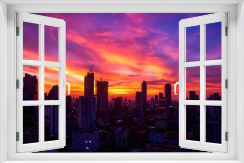 Dramatic Cityscape with Vibrant Sunset Over Bangkok Skyline
