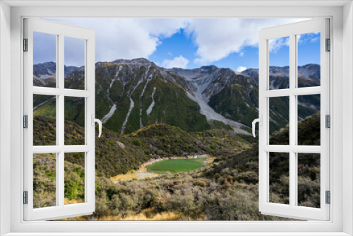 Fototapeta Naklejka Na Ścianę Okno 3D - Small green lake in cloudy mountains, Blue Lake, Tasman Glacier, New Zealand